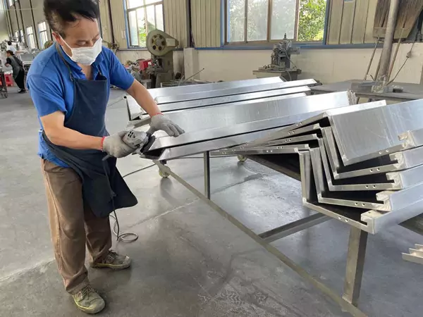 Grinding process for aluminum wall panels