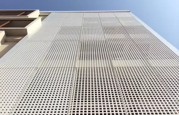 Perforated aluminum facade panels with low maintenance