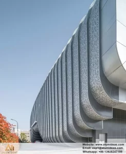 Intricate aluminum cassette facade system with a decorative scale pattern